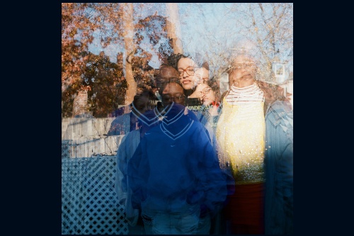 Photo of three women in backyard, with multiple exposures so their figurs are doubled and tripled with each images slightly overlapping the others