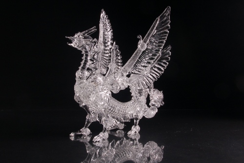 Elaborately detailed glass sculpture of a winged dragon