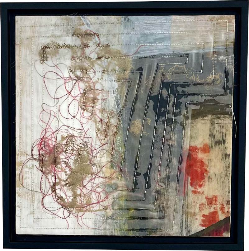 Abstract fabric sculpture, nearly two-dimensional and framed, mixes of curling and straight threads on abstractly patterned fabric