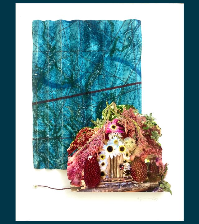 Print of multimedia artwork: background is painting of abstract blue, green, and black circles and line; foreground is sculpture of little house built of flowers